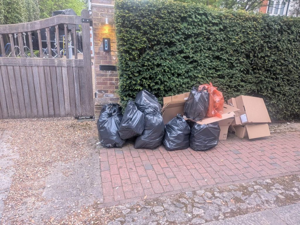 Before waste clearance in SW15 showing film and TV production waste and bulky items
